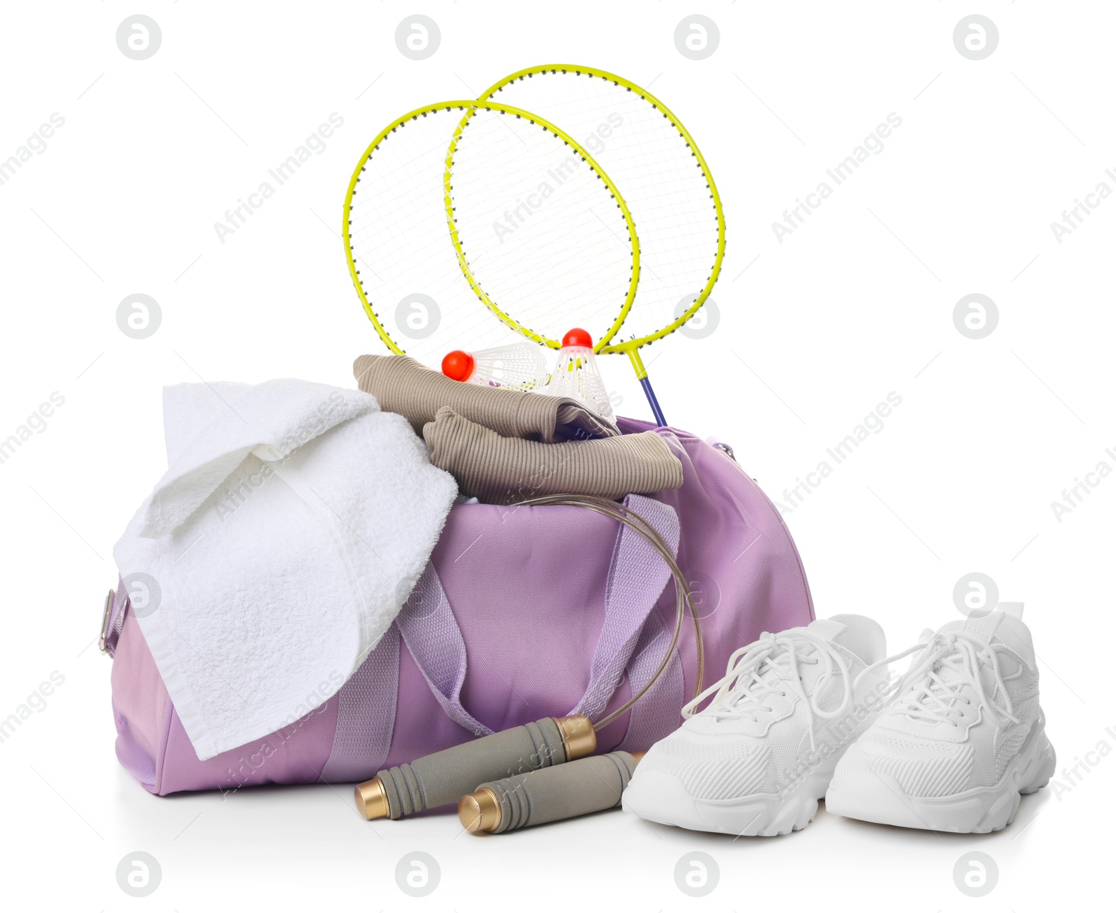 Photo of Stylish gym bag with sports equipment, towel and sneakers isolated on white