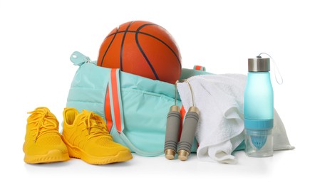 Photo of Stylish gym bag with sports equipment, towel, bottle and sneakers isolated on white