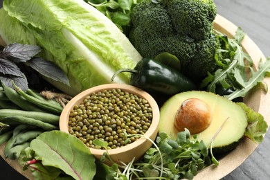 Photo of Superfood. Healthy food products in bowl on table, closeup
