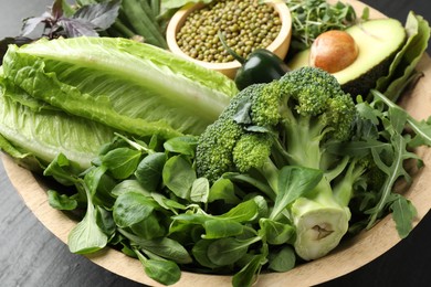 Photo of Superfood. Healthy food products in bowl on table, closeup