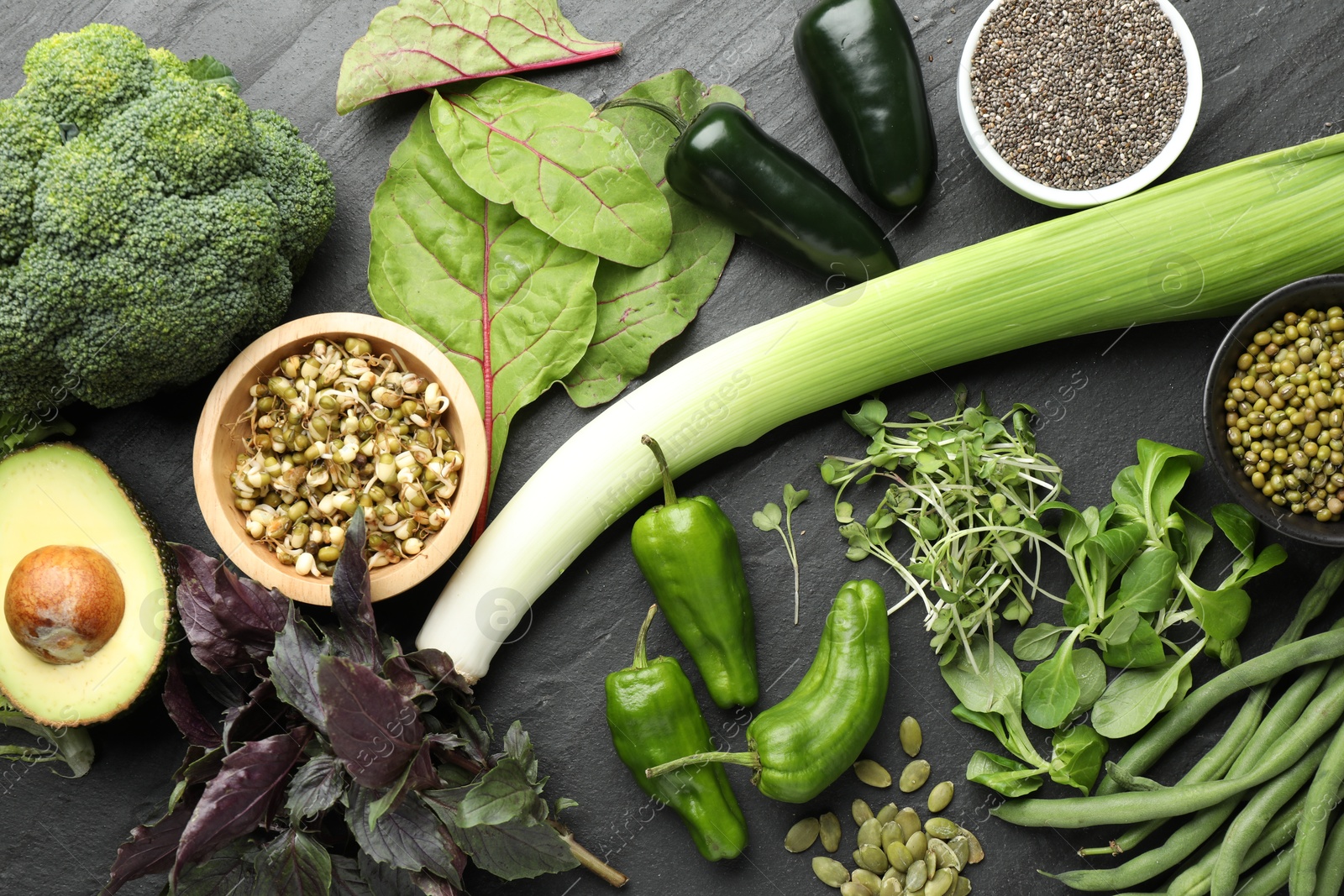 Superfood. Healthy food products on black table, flat lay Photo of Superfood. Healthy food products on black table, flat lay