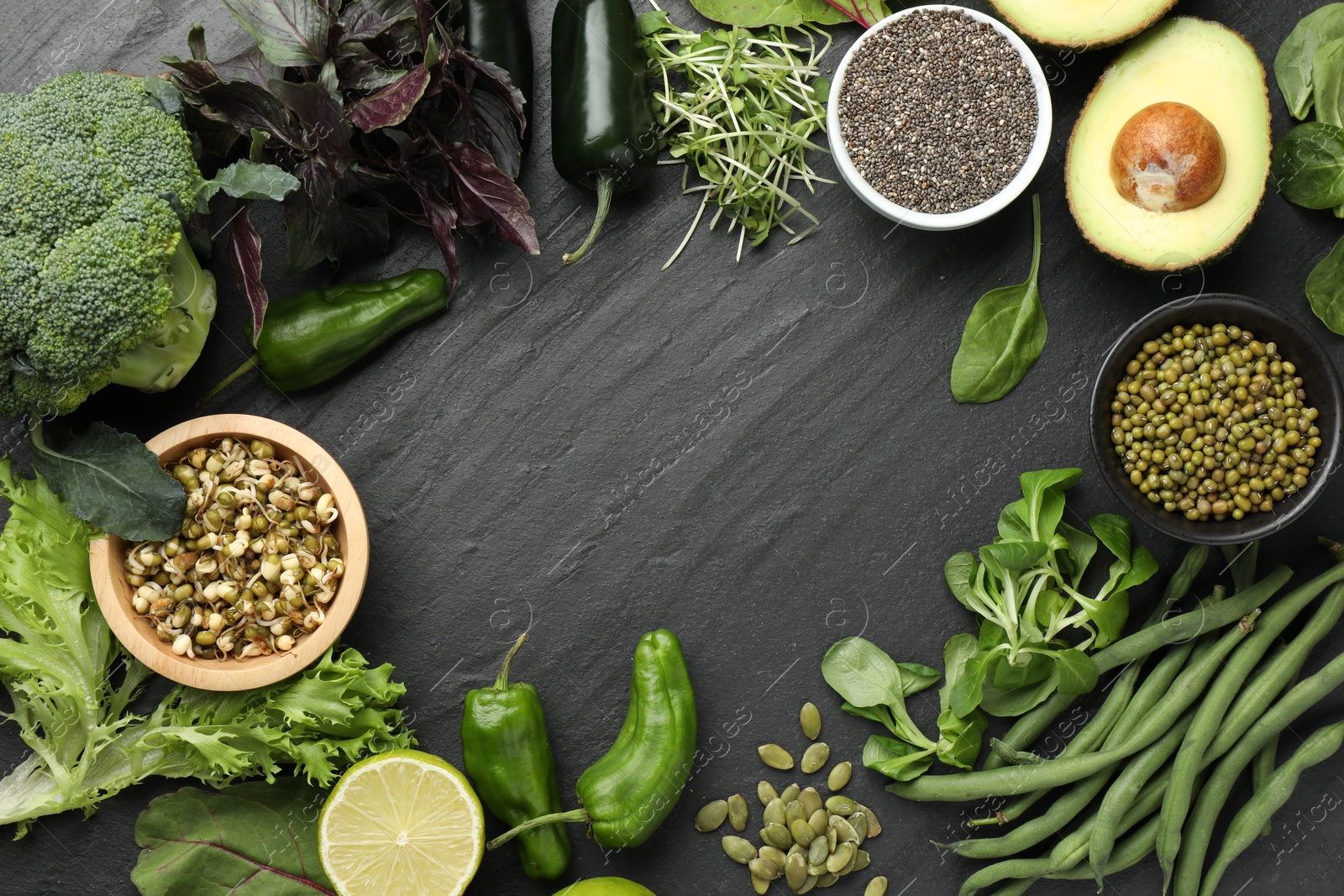 Superfood. Healthy food products on black table, flat lay. Space for text Photo of Superfood. Healthy food products on black table, flat lay. Space for text