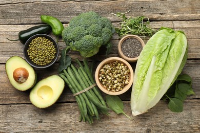 Photo of Superfood. Healthy food products on wooden table, flat lay