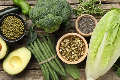 Photo of Superfood. Healthy food products on wooden table, flat lay
