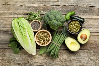 Photo of Superfood. Healthy food products on wooden table, flat lay