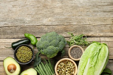Photo of Superfood. Healthy food products on wooden table, flat lay. Space for text
