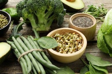 Photo of Superfood. Healthy food products on wooden table, closeup