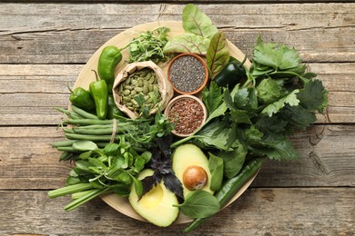 Photo of Superfood. Healthy food products on wooden table, top view