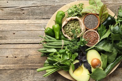 Photo of Superfood. Healthy food products on wooden table, top view. Space for text