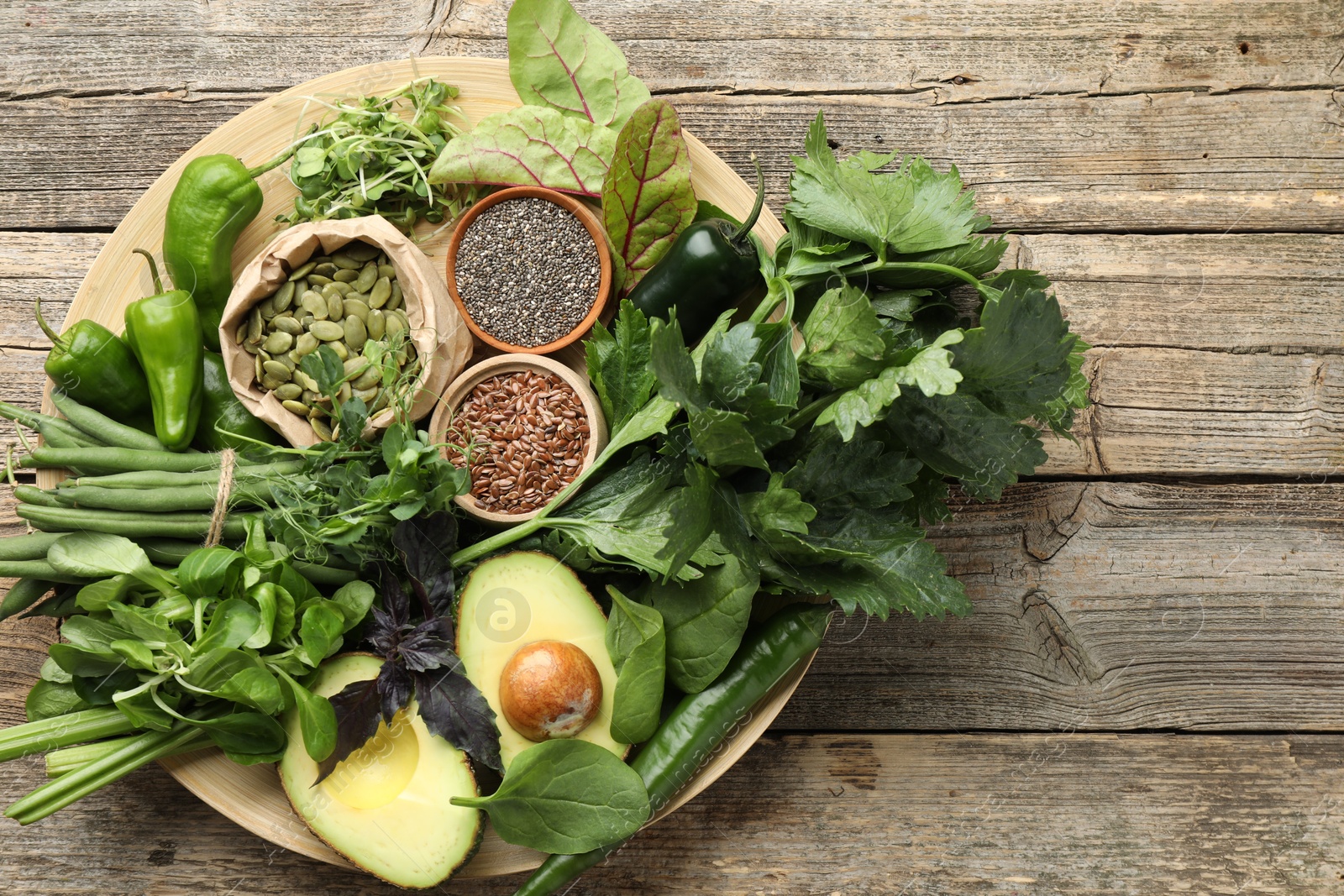 Superfood. Healthy food products on wooden table, top view. Space for text Photo of Superfood. Healthy food products on wooden table, top view. Space for text