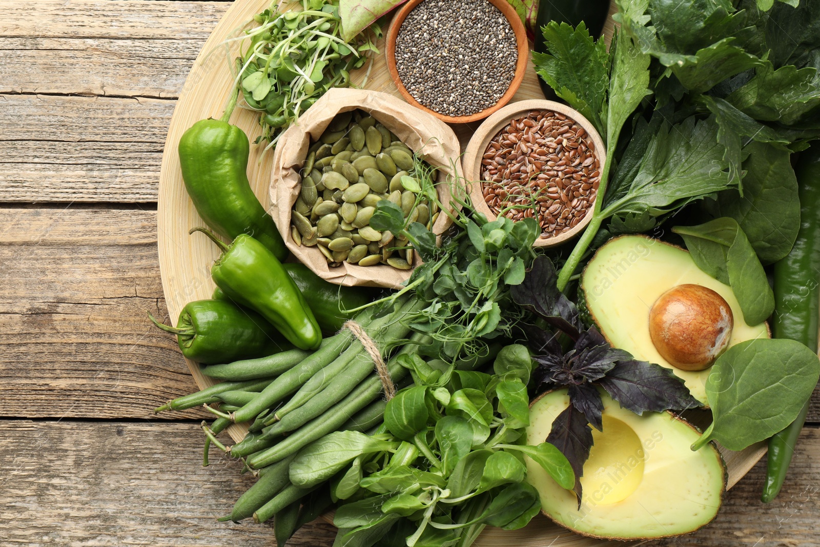 Superfood. Healthy food products on wooden table, top view Photo of Superfood. Healthy food products on wooden table, top view