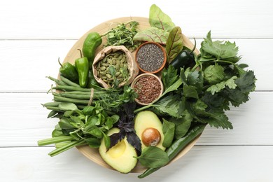 Photo of Superfood. Healthy food products on white wooden table, top view