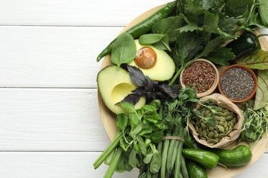 Photo of Superfood. Healthy food products on white wooden table, top view. Space for text