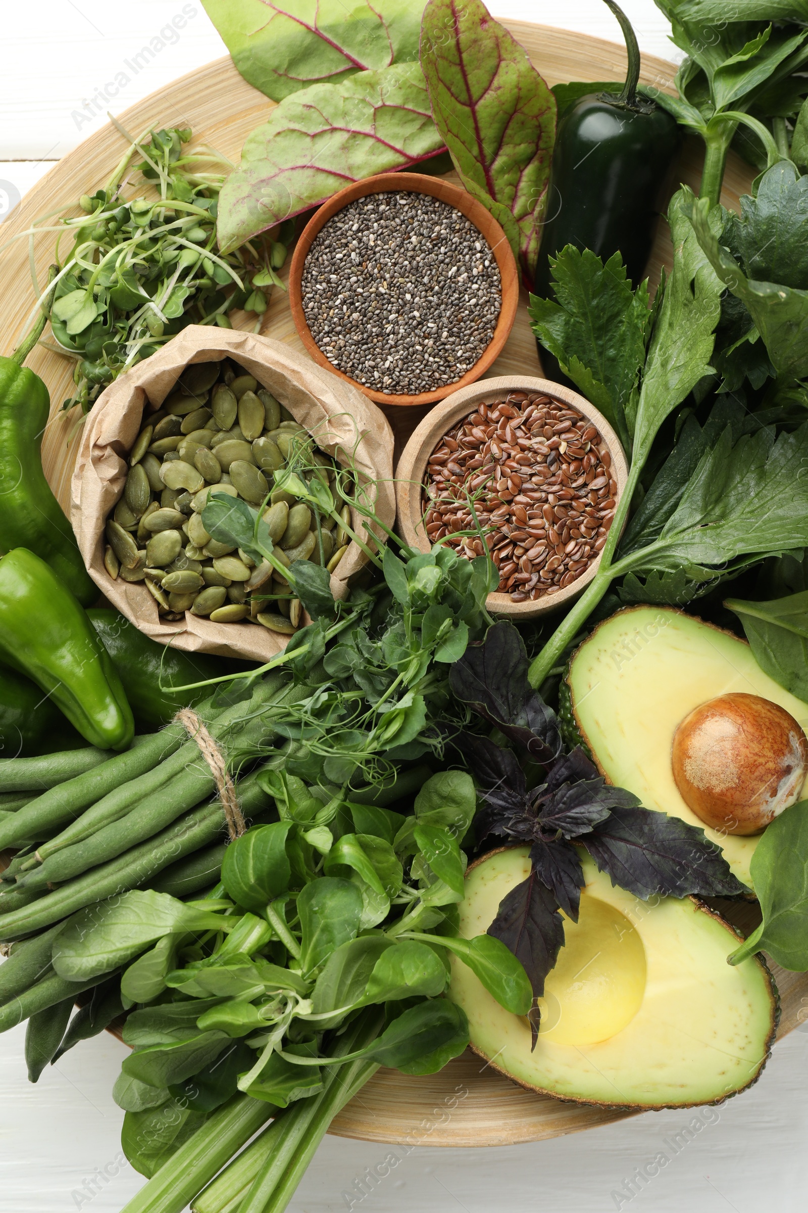 Superfood. Healthy food products on white table, top view Photo of Superfood. Healthy food products on white table, top view