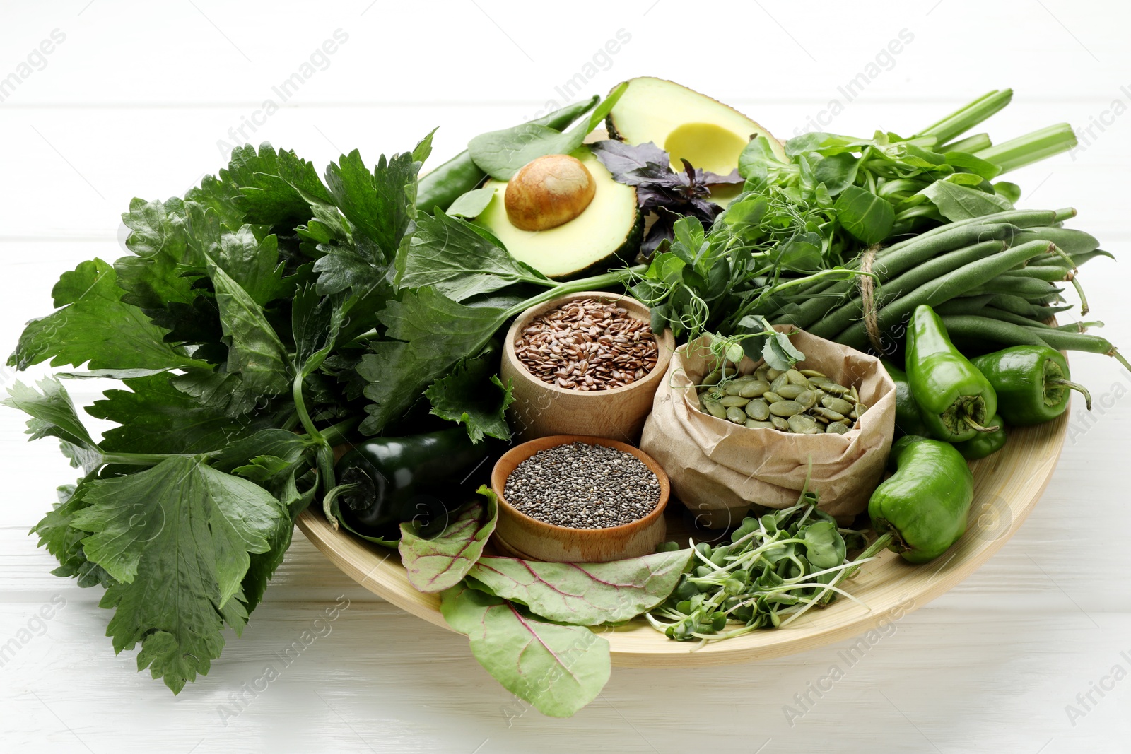 Photo of Superfood. Healthy food products on white wooden table, closeup