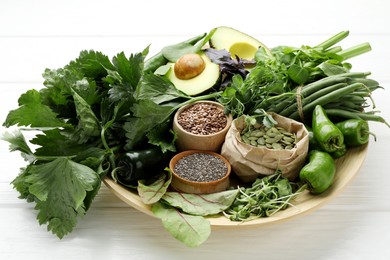 Photo of Superfood. Healthy food products on white wooden table, closeup