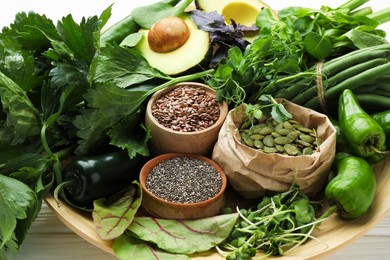 Photo of Superfood. Healthy food products on white wooden table, closeup