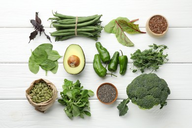 Photo of Superfood. Healthy food products on white wooden table, flat lay