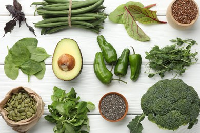 Photo of Superfood. Healthy food products on white wooden table, flat lay