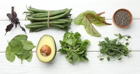 Photo of Superfood. Healthy food products on white wooden table, flat lay