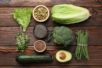 Photo of Superfood. Healthy food products on wooden table, flat lay