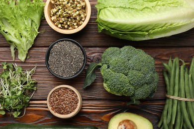 Photo of Superfood. Healthy food products on wooden table, flat lay