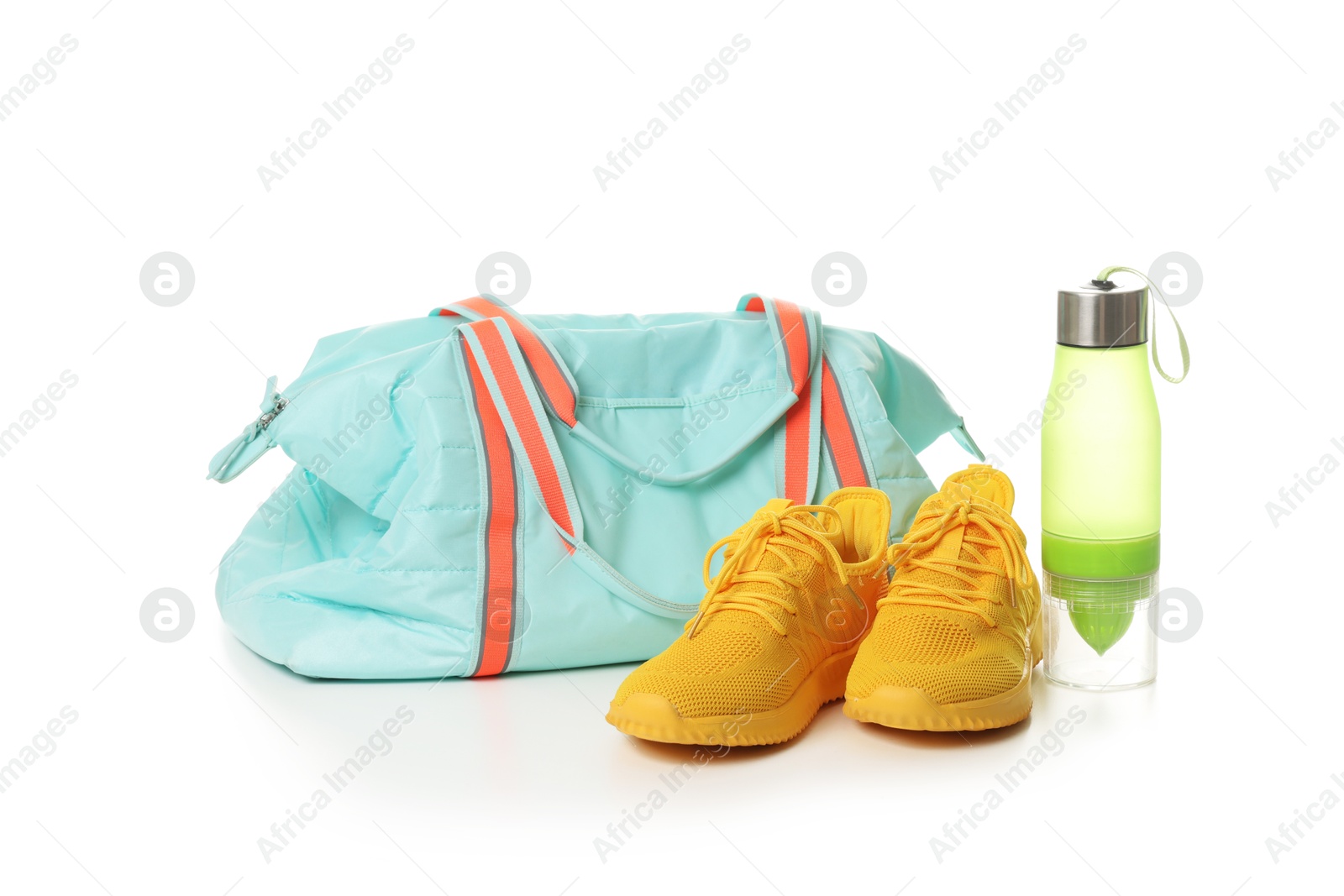 Photo of Stylish sports bag, bottle and sneakers isolated on white