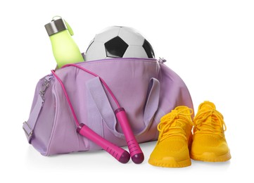 Photo of Stylish gym bag with sports equipment, bottle and sneakers isolated on white