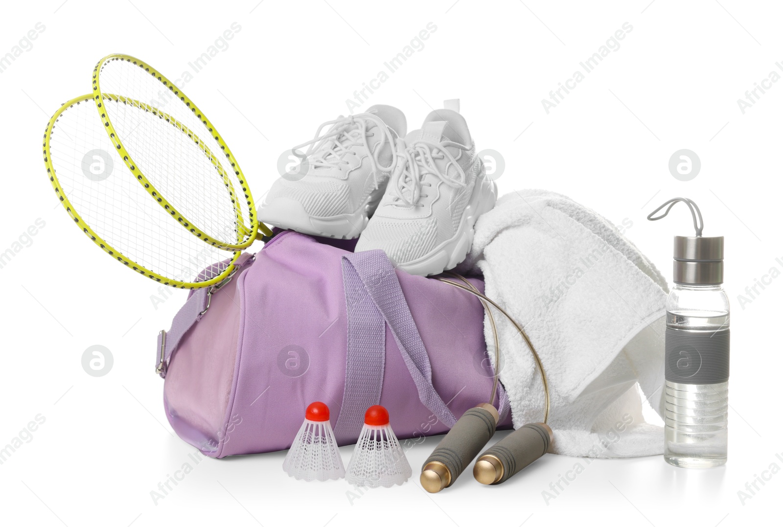 Photo of Stylish gym bag with sports equipment, bottle and sneakers isolated on white