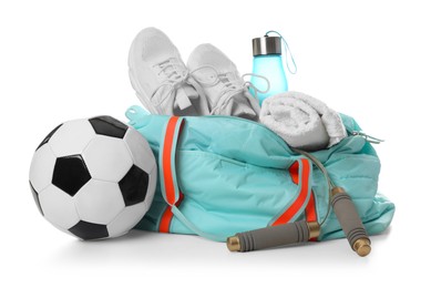 Photo of Stylish gym bag with sports equipment, towel, bottle and sneakers isolated on white