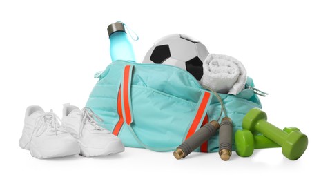Photo of Stylish gym bag with sports equipment, towel, bottle and sneakers isolated on white