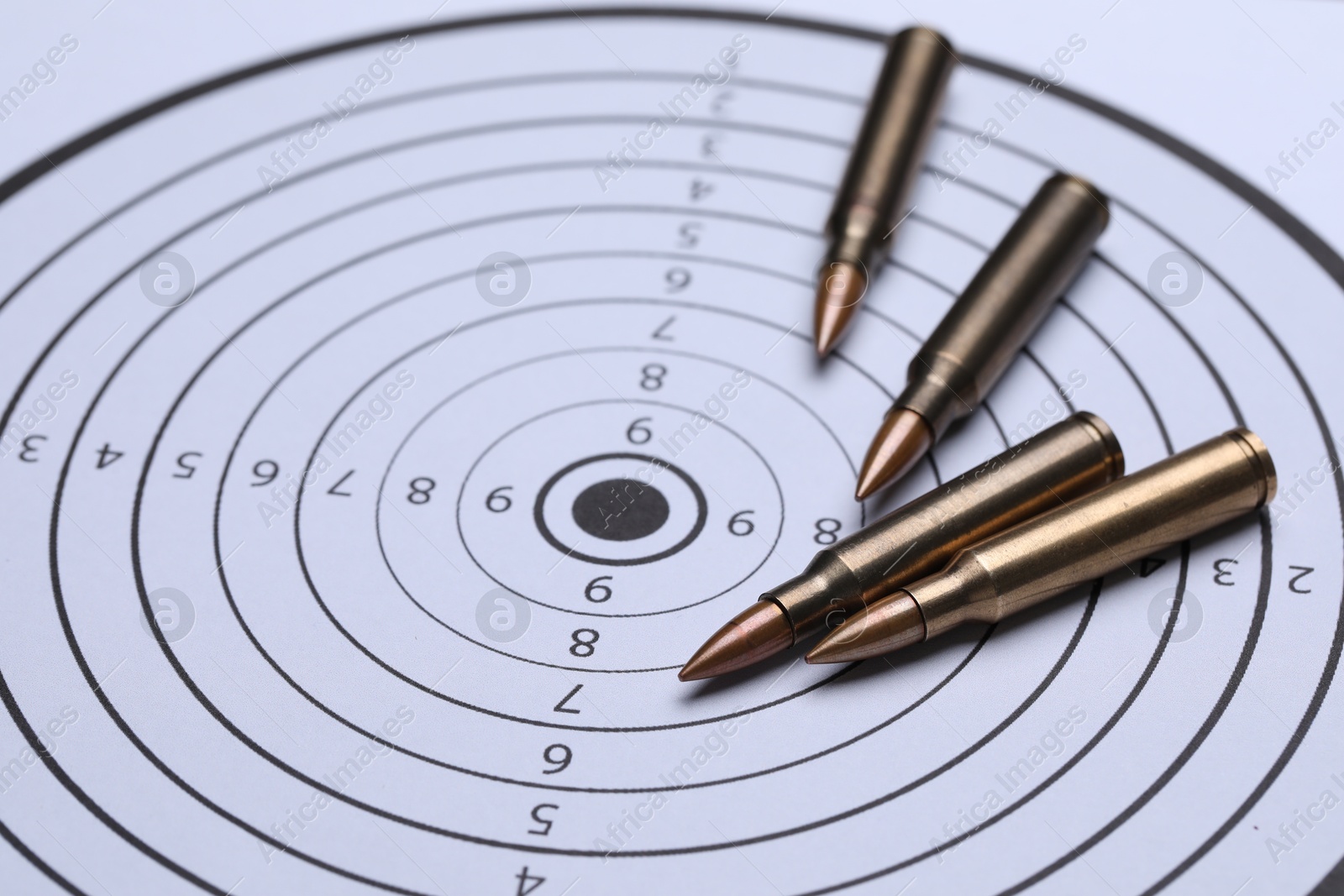 Many metal bullets on shooting target, closeup Photo of Many metal bullets on shooting target, closeup