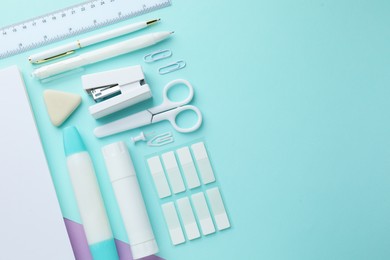 Photo of Different white stationery on color background, flat lay. Space for text