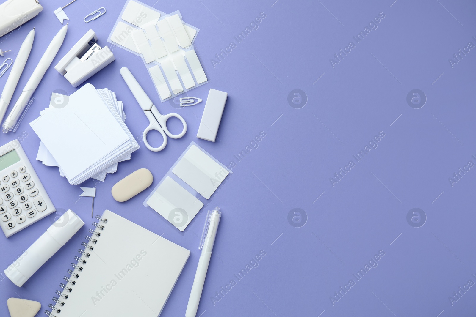 Photo of Different white stationery on violet background, flat lay. Space for text