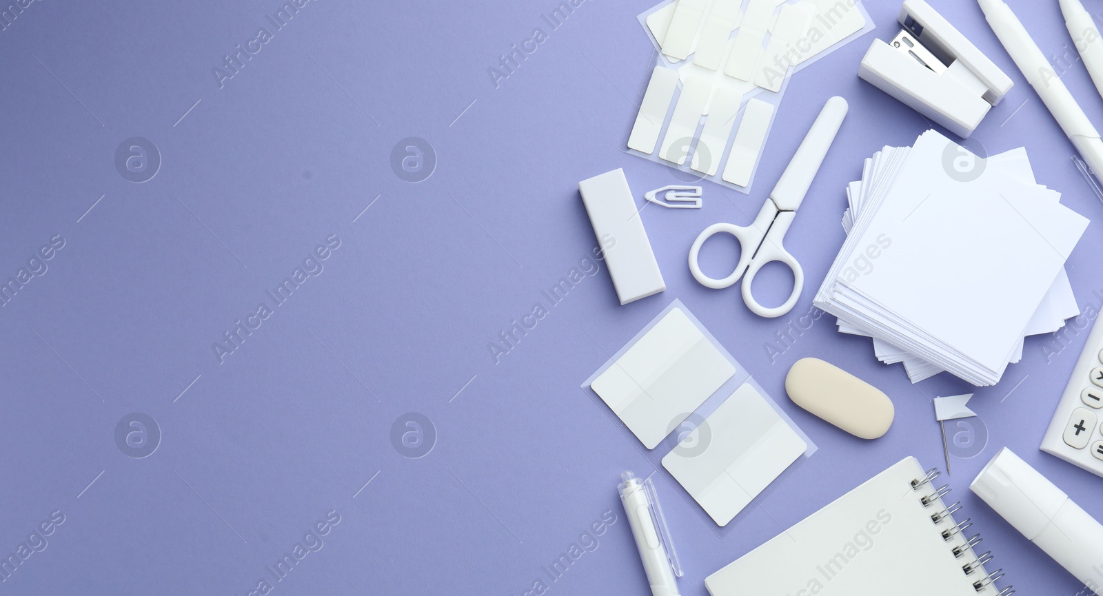 Photo of Different white stationery on violet background, flat lay. Space for text