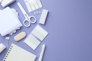 Photo of Different white stationery on violet background, flat lay. Space for text