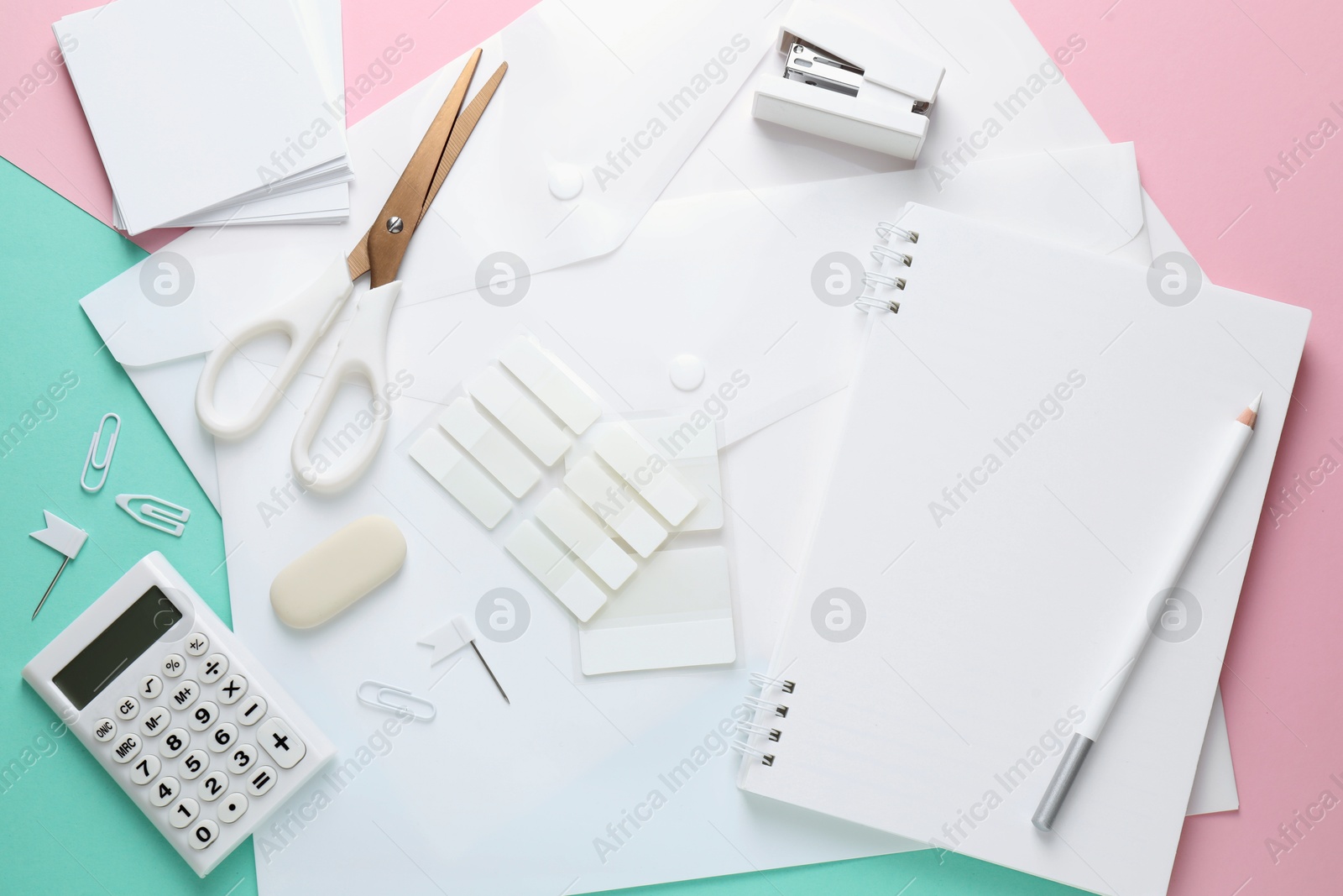 Photo of Different white stationery on color background, flat lay