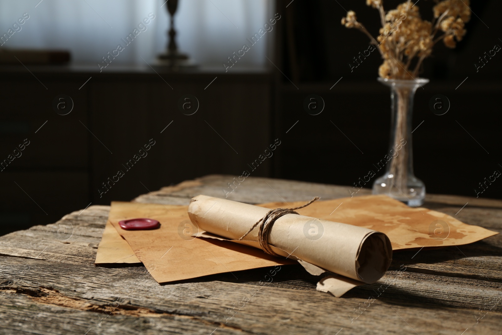 Old paper scrolls on wooden table, closeup Photo of Old paper scrolls on wooden table, closeup