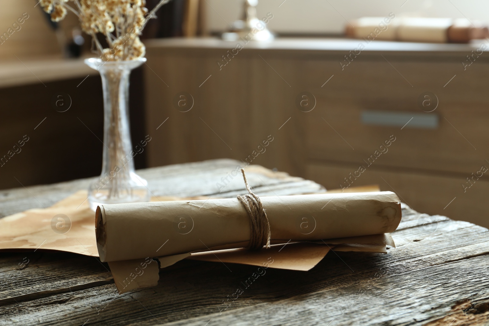 Old paper scrolls on wooden table, closeup Photo of Old paper scrolls on wooden table, closeup