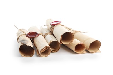 Photo of Old rolled paper scrolls isolated on white