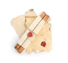 Photo of Sheets and scroll of old paper isolated on white, top view