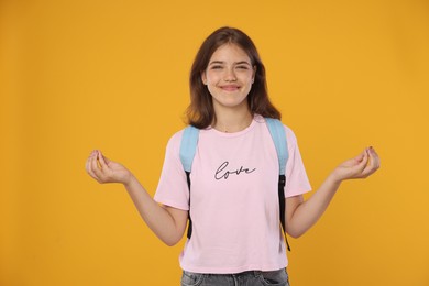 Photo of Student meditating before exam on orange background