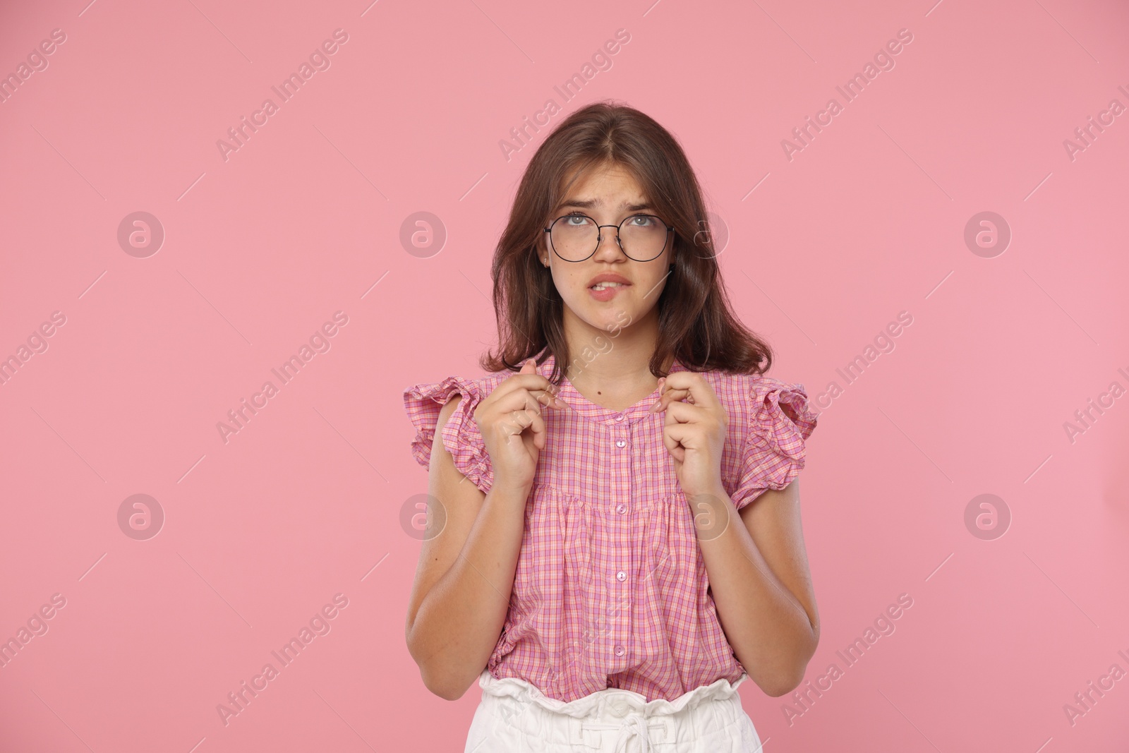 Student crossing fingers on pink background. Hope for good exam result Photo of Student crossing fingers on pink background. Hope for good exam result