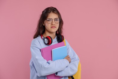 Photo of Student worried about her exam result on pink background