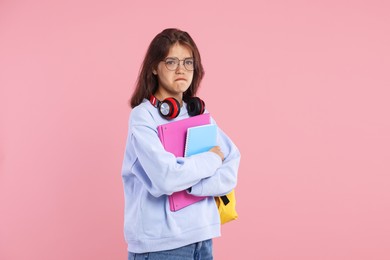 Photo of Student worried about her exam result on pink background