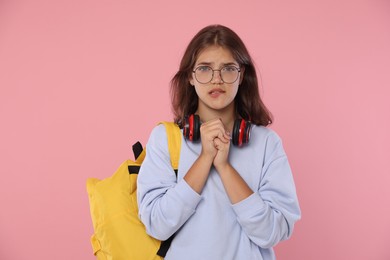 Photo of Student praying for good exam result on pink background