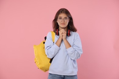 Photo of Student praying for good exam result on pink background