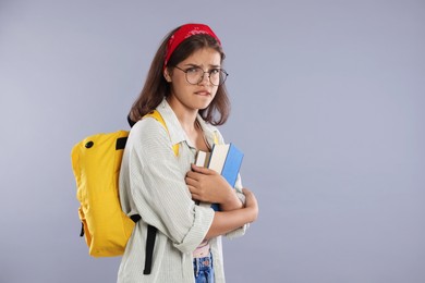 Photo of Student worried about her exam result on gray background. Space for text