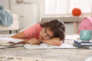 Photo of Tired student preparing for exam at home