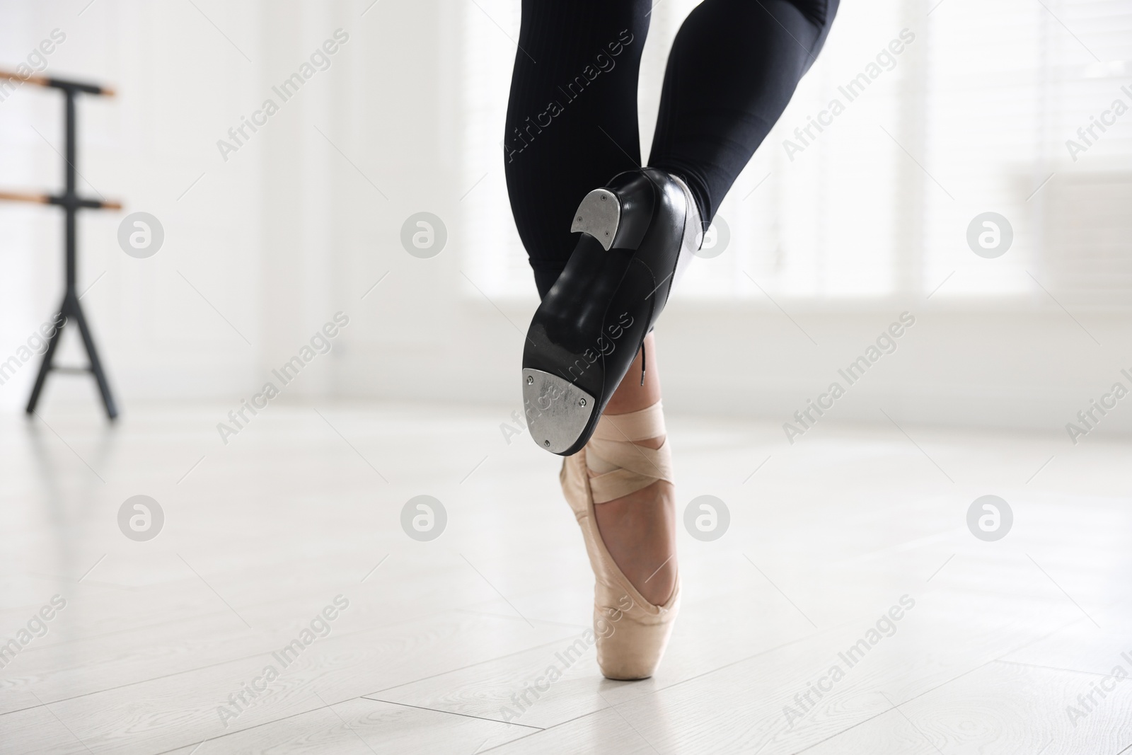 Teenage girl in tap and pointe shoe indoors, closeup Photo of Teenage girl in tap and pointe shoe indoors, closeup